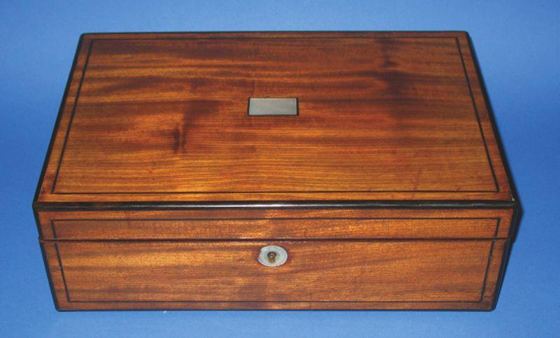 Appraisal: A REGENCY MAHOGANY AND EBONY STRUNG WRITING SLOPE the rectangular