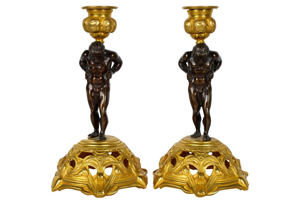 Appraisal: PAIR OF PATINATED GILT BRONZE FIGURAL CANDLESTICKSCondition both wobble slightly