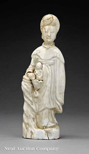 Appraisal: A Chinese White Glazed Figure of a Standing Guanyin probably