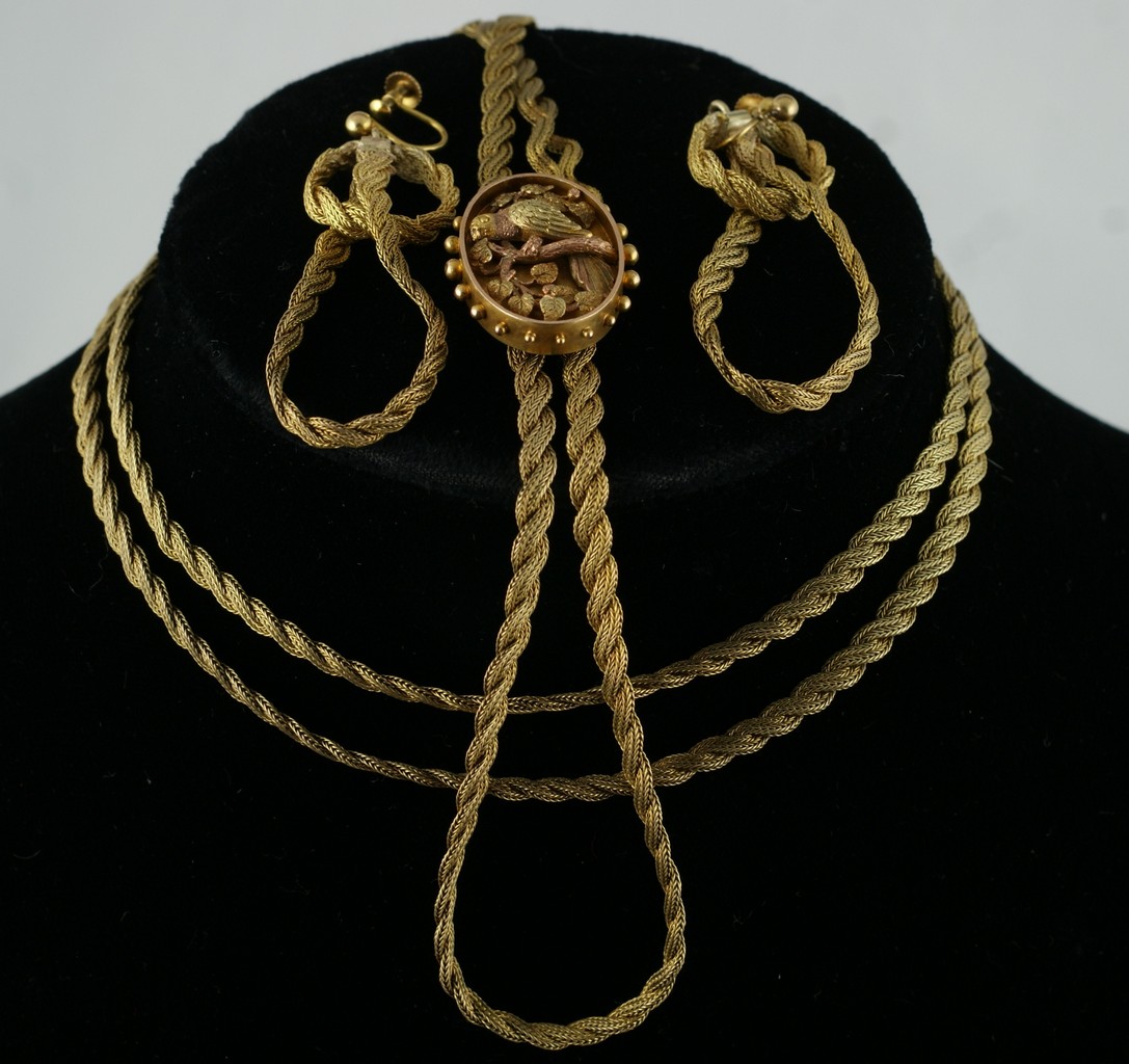 Appraisal: Unmarked YG chain with sliding tri-color gold medallion depicting a