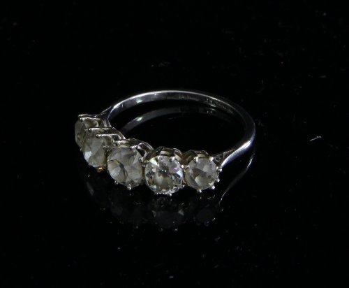 Appraisal: A diamond five-stone ring the cushion shaped stones claw set