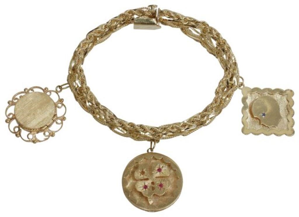 Appraisal: Estate kt yellow gold charm bracelet with three charms one