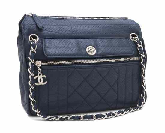 Appraisal: A Chanel Blue Perforated Leather Bag with chainlink strap logo