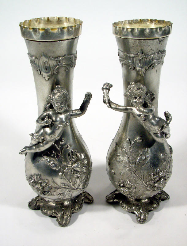 Appraisal: Pair of silver plated WMF vases relief moulded with cherubs