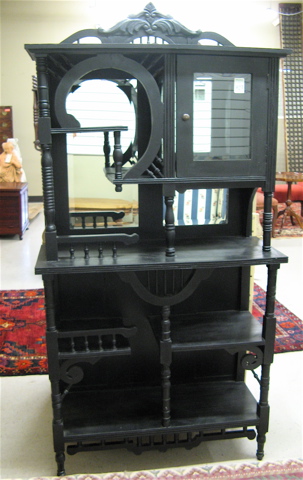 Appraisal: VICTORIAN STYLE EBONIZED ETAGERE having a variety of open display