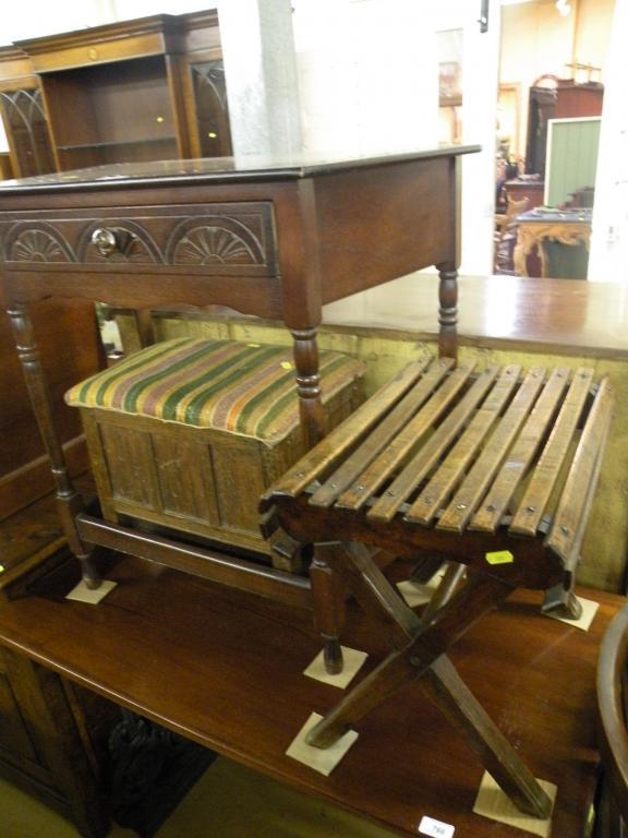 Appraisal: A carved oak side table with one frieze drawer a