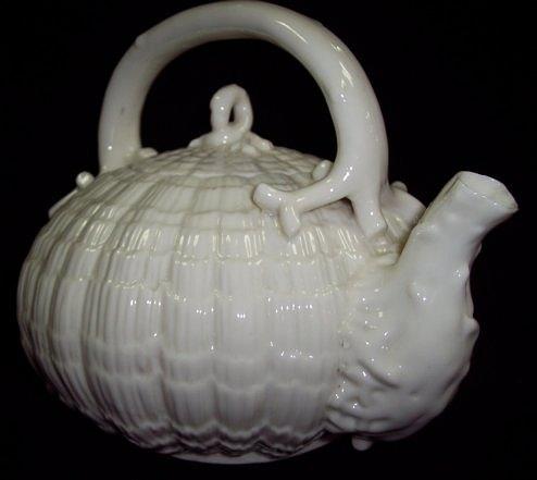 Appraisal: A Belleek Tridacna kettle and cover of lattice design the