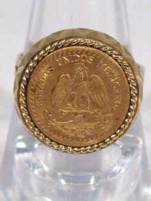 Appraisal: An carat gold coin ring set with a Mexican gold