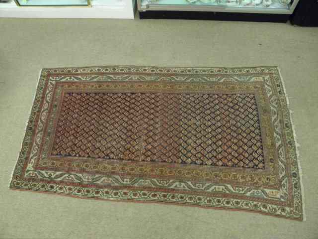 Appraisal: Turkoman area rug hand knotted with a repeating pattern with