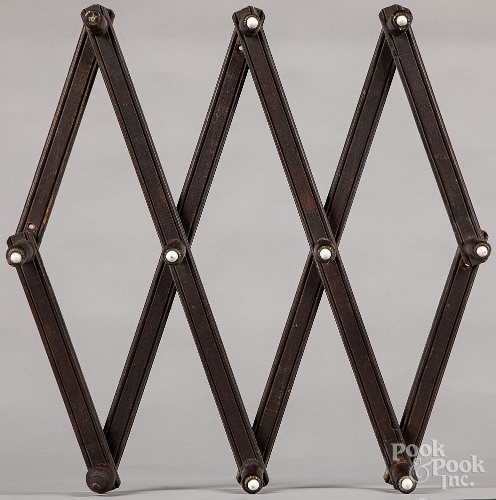 Appraisal: Peg rack together with a Black Forest frame Accordion action