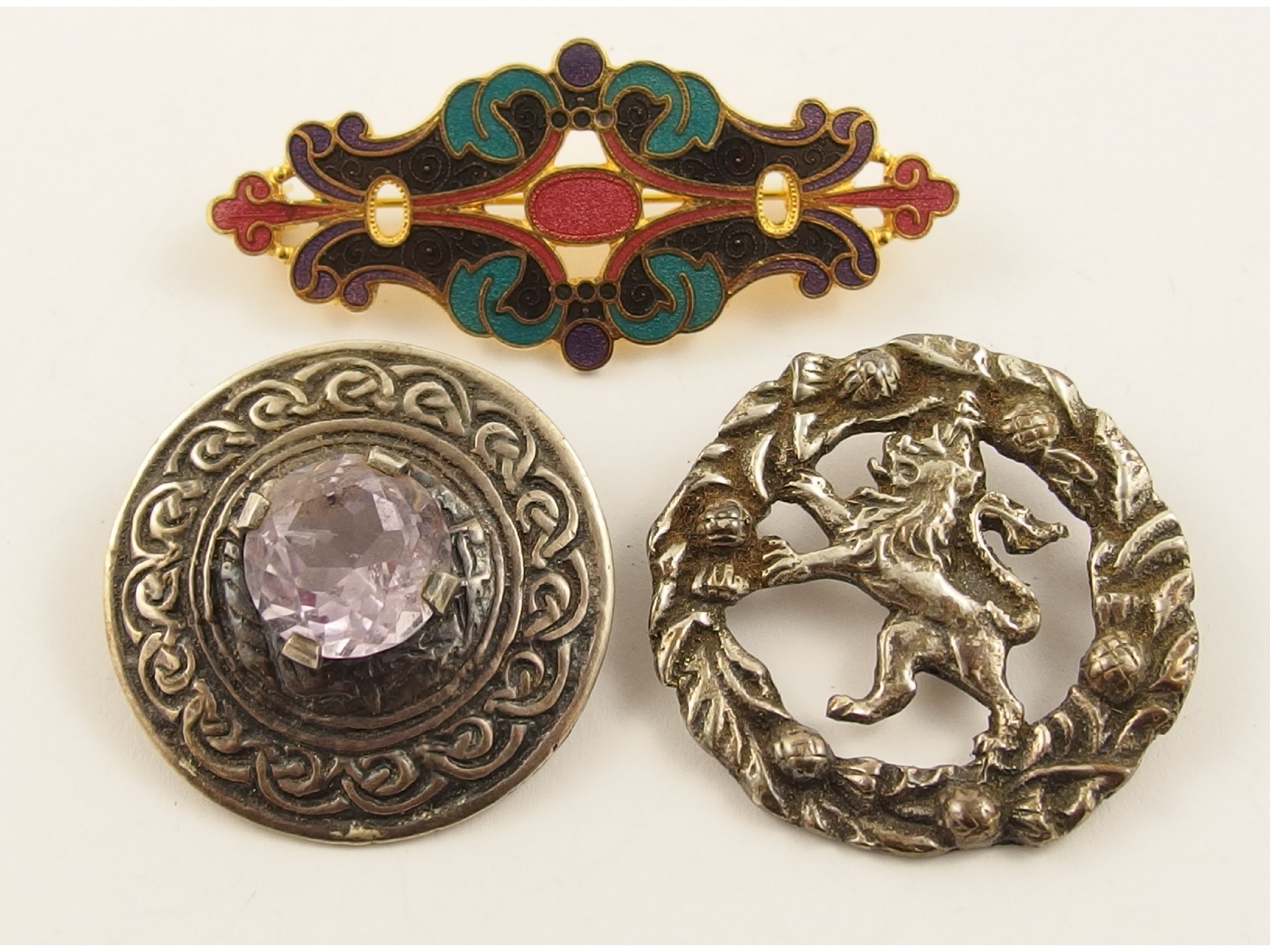 Appraisal: Two Scottish silver brooches and an enamel example by Fish