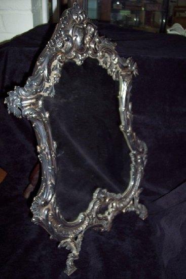 Appraisal: An easel dressing table mirror the cartouche shaped glass within