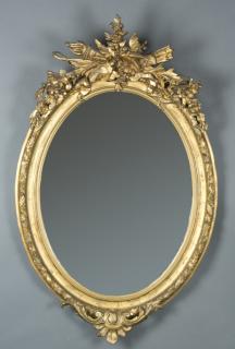 Appraisal: Louis XVI detailed carved oval gilt mirror A Louis XV