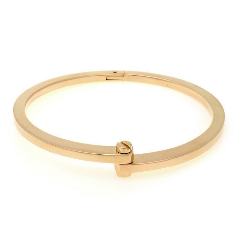 Appraisal: Cartier Menotte k Yellow Gold Screw Motif Bypass This gorgeous