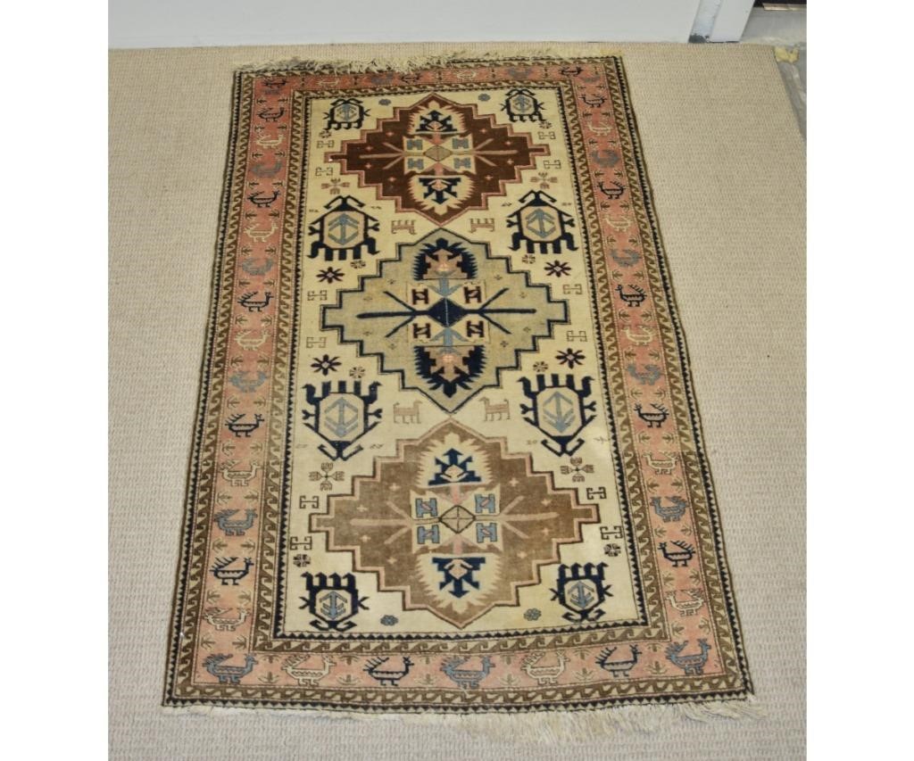 Appraisal: Persian center hall carpet with cream colored field geometric patterns