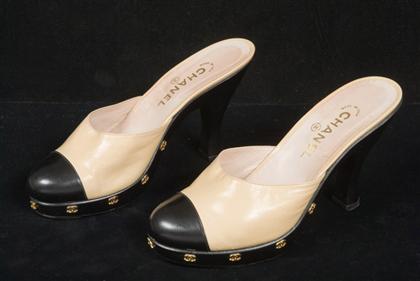 Appraisal: Black and tan Chanel high-heel clogs spring With small gold