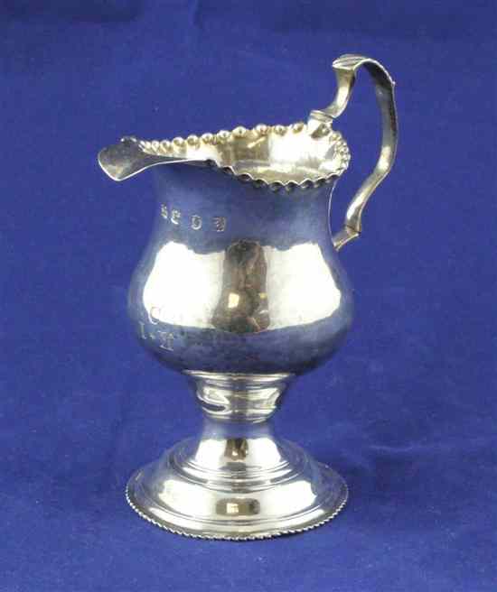 Appraisal: A George III silver inverted pear shaped cream jug with