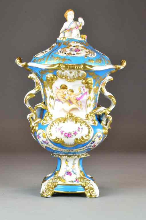 Appraisal: Dresden Meissen Style Covered Urn with CherubsDepicting cupids at play