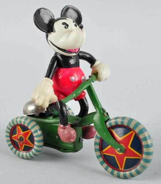 Appraisal: Celluloid Mickey Riding Tricycle Wind-Up Toy Description Japanese Circa s