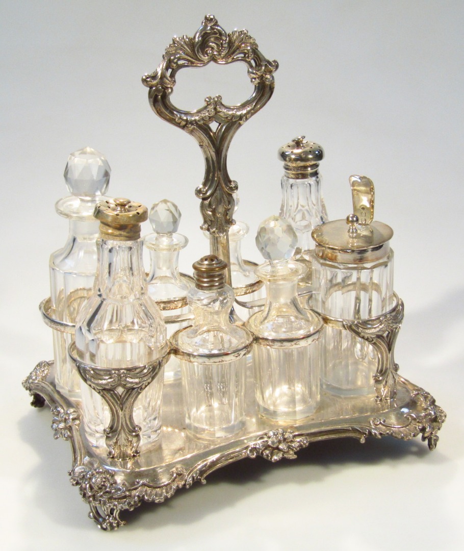 Appraisal: An early thC silver plated cruet stand set with eight