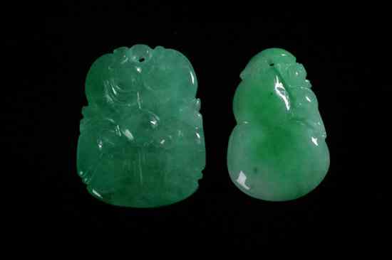 Appraisal: TWO CHINESE APPLE GREEN JADEITE PENDANTS One carved to depict