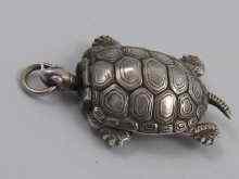 Appraisal: A Japanese white metal tests silver turtle pendant with hinged