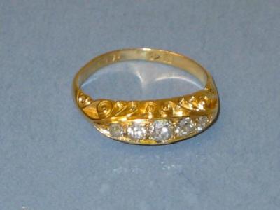 Appraisal: A VICTORIAN FIVE STONE DIAMOND RING the graduated old brilliant