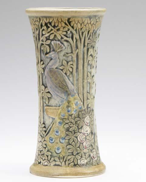 Appraisal: WELLER Knifewood corseted vase with peacock amongst trees and flowers