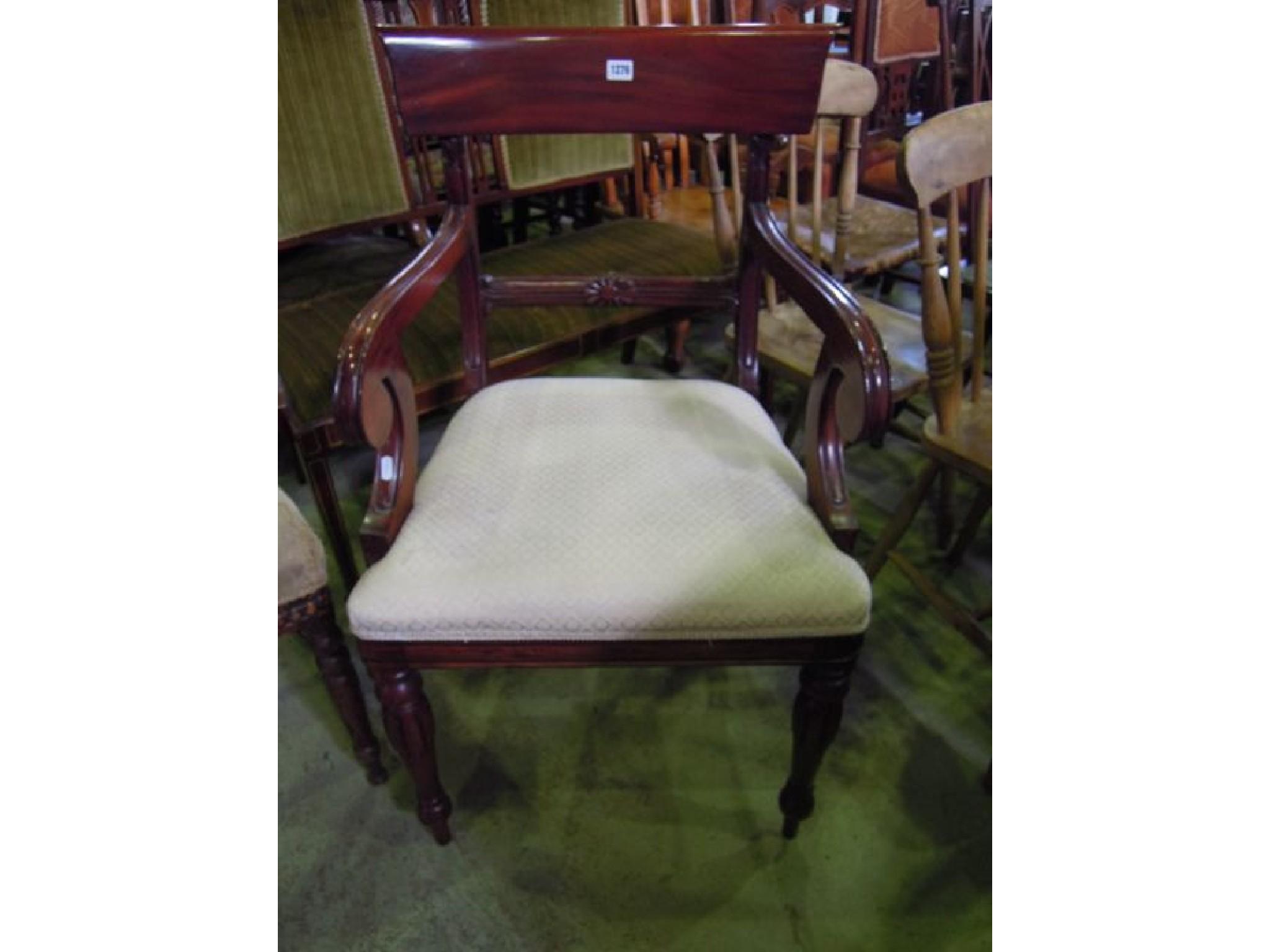 Appraisal: A reproduction mahogany bar back elbow chair in the Regency