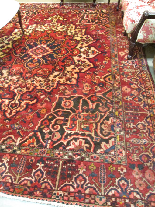 Appraisal: HAND KNOTTED ORIENTAL CARPET red field Indo-Bokhara ' x '