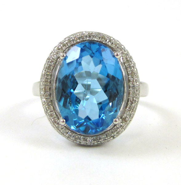 Appraisal: BLUE TOPAZ AND DIAMOND RING k white gold with round-cut