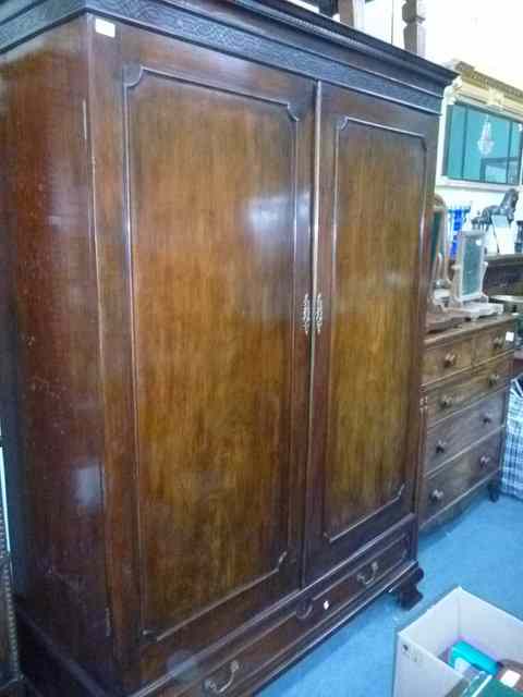 Appraisal: A TH CENTURY MAHOGANY WARDROBE the cornice with blind fretwork