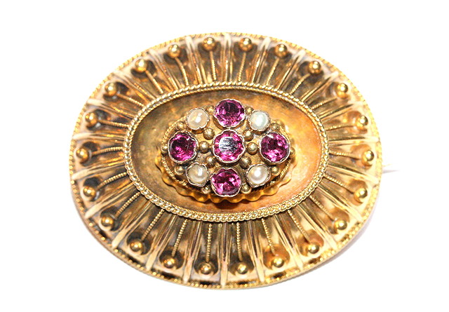 Appraisal: A VICTORIAN OVAL BROOCH set with five garnets and four