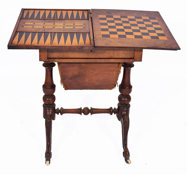 Appraisal: A VICTORIAN FIGURED WALNUT GAMING TABLE with inlaid playing surfaces