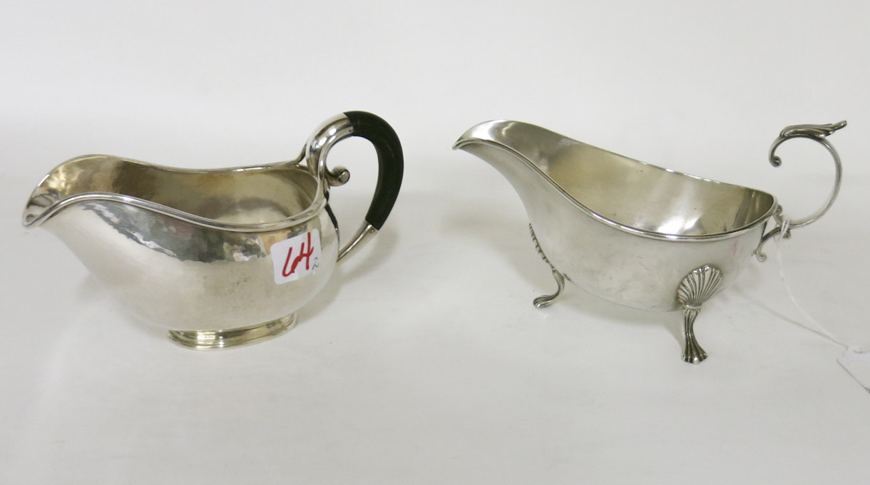 Appraisal: TWO STERLING SILVER SAUCE BOATS one with wood handle hallmarked