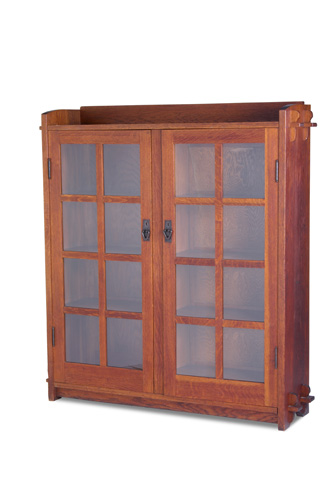 Appraisal: GUSTAV STICKLEY Two-door bookcase with eight panes per door keyed