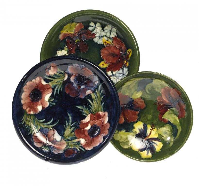 Appraisal: A MOORCROFT ORCHID DISH ANEMONE DISH AND HIBISCUS FOOTED DISH