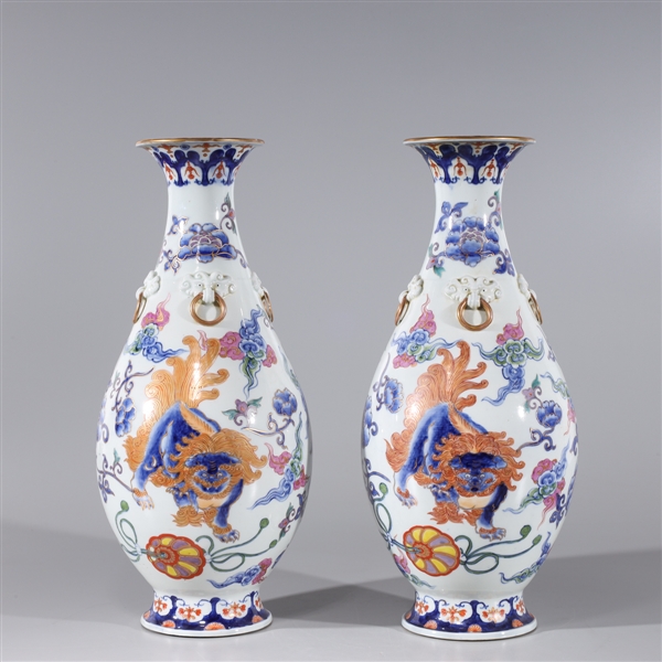 Appraisal: Pair of Chinese famille rose enameled porcelain vases drilled for