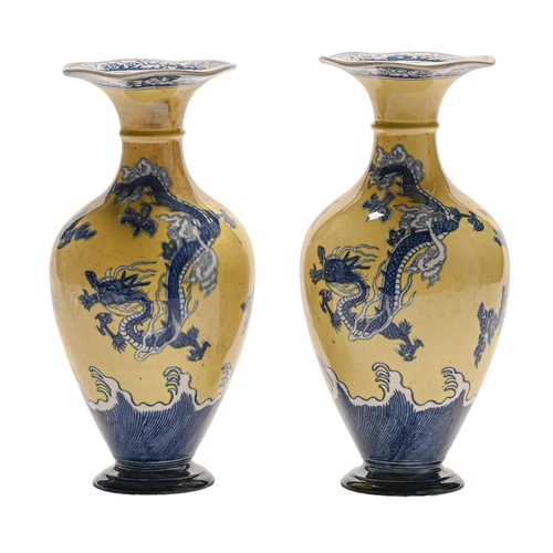 Appraisal: A pair of Wedgwood yellow ground blue printed earthenware dragon