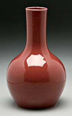 Appraisal: Chinese sang de boeuf vase bottle form strawberry glaze white