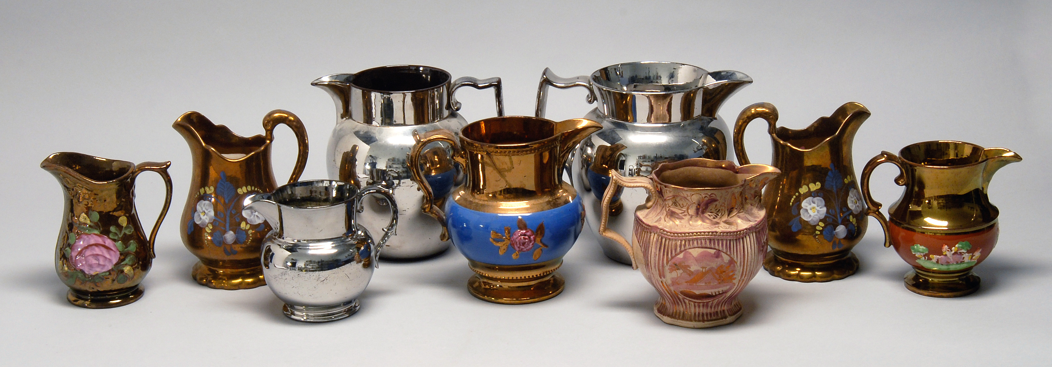 Appraisal: NINE ENGLISH LUSTERWARE PITCHERS AND CREAM JUGS th and Early