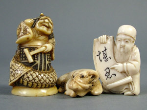 Appraisal: A Japanese ivory netsuke of Kiyohime holding a hammer height