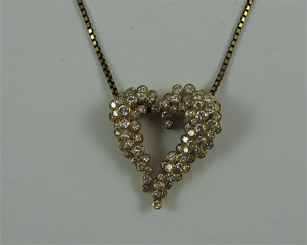 Appraisal: DIAMOND AND YELLOW GOLD HEART PENDANT NECKLACE the K yellow