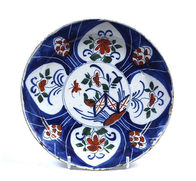 Appraisal: AN TH CENTURY POLYCHROME DELFT WARE PLATE decorated with stylized