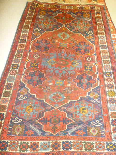 Appraisal: AN EAST CAUCASIAN RUG c the navy blue field with