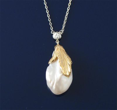 Appraisal: A Mississippi pearl pendant in an engraved gold mount to