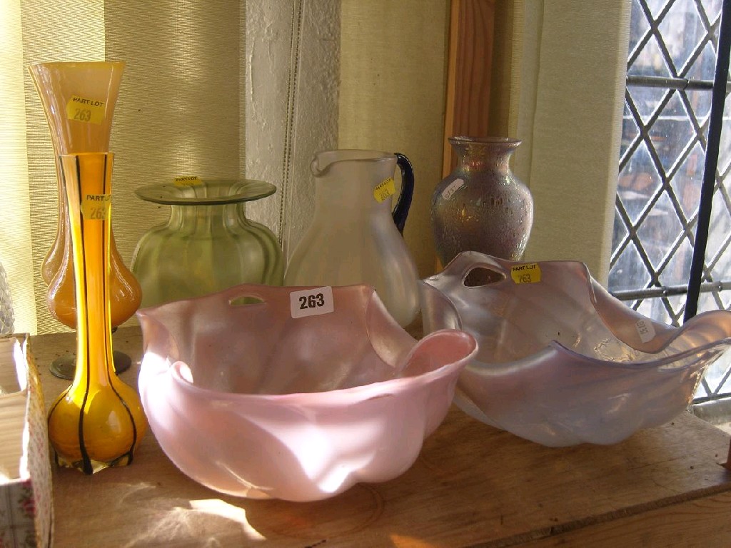 Appraisal: A matched pair of pink and mauve glass baskets with