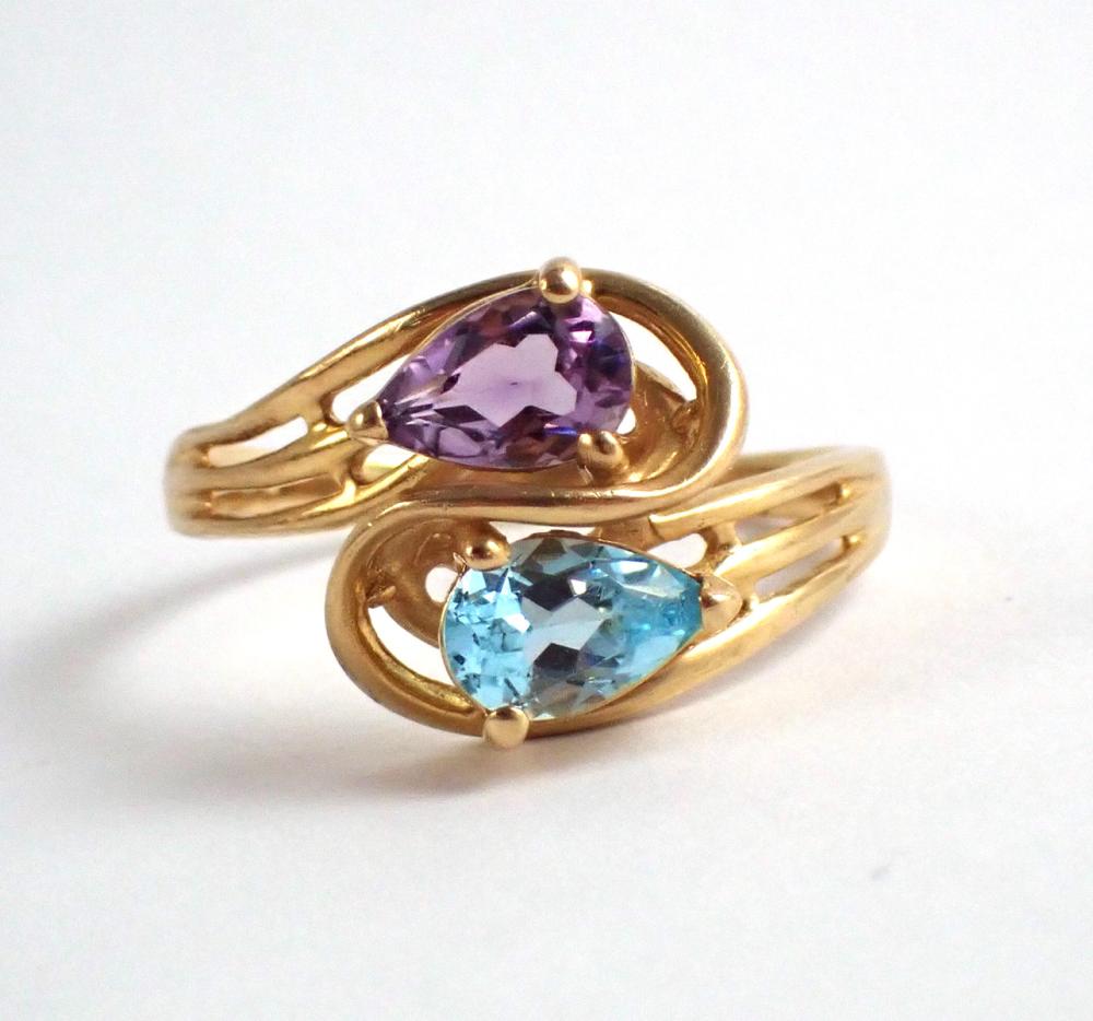 Appraisal: AMETHYST BLUE TOPAZ AND FOURTEEN KARAT GOLD RING set with