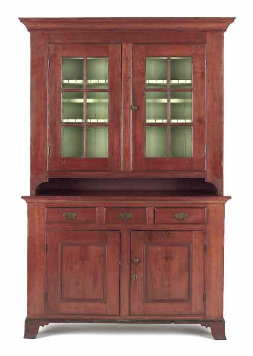 Appraisal: Pennsylvania cherry two-part Dutch cupboard ca h w