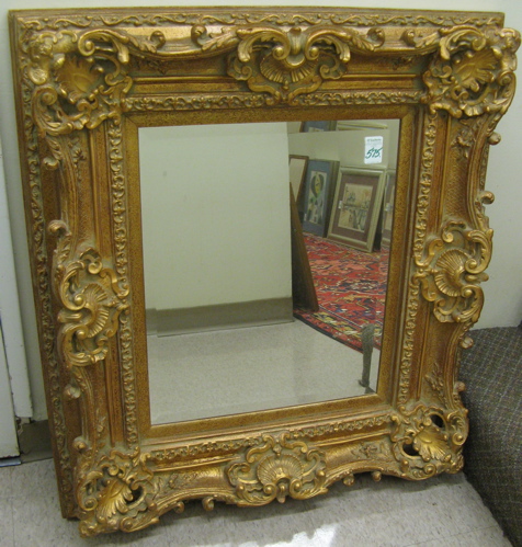 Appraisal: VICTORIAN STYLE RECTANGULAR WALL MIRROR The gilt light weight resin